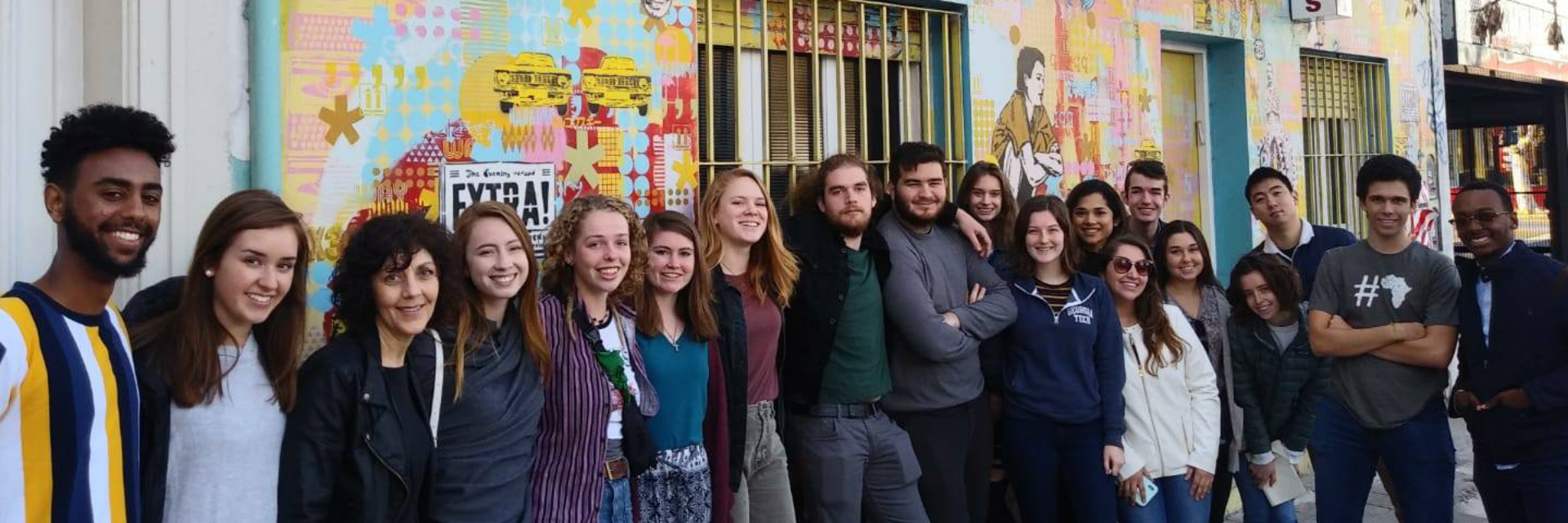 Georgia Tech students in front of a mural